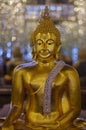 UTHAI THANI PROVINCE, THAILAND - August, 2016: Golden Buddha statue at Cathedral glass, Wat Tha Sung or Wat Chantharam