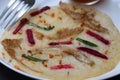 Uthappam, dosa from South India, thicker, Pancakes with toppings of mushrooms, beetroot, chilli and carrots Royalty Free Stock Photo