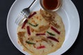 Uthappam, dosa from South India, thicker, Pancakes with toppings of mushrooms, beetroot, chilli and carrots Royalty Free Stock Photo