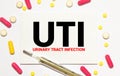 UTI- Urinary Tract Infection written in notebook