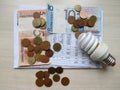 Utility bills, rent, Belarusian rubles. Energy saving light bulb