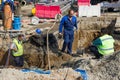 Utility crew fixing broken water main Royalty Free Stock Photo