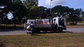 Utility man collecting wastes to the garbage truck Royalty Free Stock Photo