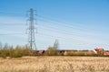 A utility pole and electric power lines above the houses - Horizontal