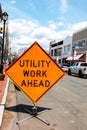 Utility work ahead  sign on Maind Street with blue sky and clouds Royalty Free Stock Photo