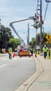 Utility workers in a cherry picker