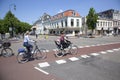 People walk and ride bike on bridge between centre and witte vrouwen in old town of utrecht. Royalty Free Stock Photo