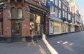 Showcases of shops on sunday morning with empty street view