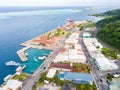 Uturoa, French Polynesia: City centre, port harbour, and ferries to Tahaa. Raiatea, Leeward/Society Islands, Oceania. Aerial view.