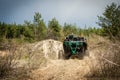 UTV, ATV off road driving in sandy open area. Buggy extreme riding