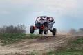 UTV buggy in the action on sand in summer