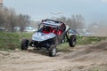 UTV buggy in the action on sand in summer