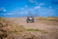 UTV buggy offroad vehicle racing on sand. Extreme, adrenalin. 4x4