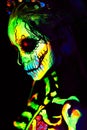 UV body art painting of helloween female skeleton Royalty Free Stock Photo