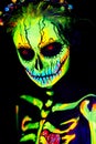 UV body art painting of helloween female skeleton