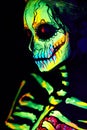 UV body art painting of helloween female skeleton Royalty Free Stock Photo