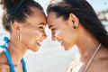 UV got a friend in me. two beautiful young women at the beach with sunscreen on their faces smiling at each other. Royalty Free Stock Photo