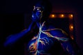 UV patterns body art of the circulatory system on a man`s body. On the torso of a muscular athlete, veins and arteries