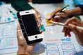 UX developer and ui designer brainstorming about mobile app interface wireframe design with customer breif and color code, User Royalty Free Stock Photo
