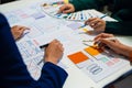 UX developer and ui designer brainstorming about mobile app interface wireframe design with customer breif and color code, User Royalty Free Stock Photo