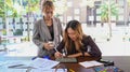 Ux developer and ui designer discussing about mobile app interface wireframe design together. Royalty Free Stock Photo