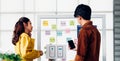 Ux developer and ui designer presenting  and testing mobile app interface design on whiteboard in meeting at modern office. Royalty Free Stock Photo