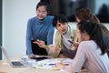 Ux developer and ui designer use augmented reality brainstorming about mobile app interface wireframe design on desk at Royalty Free Stock Photo