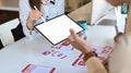 Ux developer and ui designer are using tablet and discussing ideas for new project. Royalty Free Stock Photo