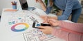 UX and UI Design Process. Designers analyzing mobile app prototypes and sketches. Royalty Free Stock Photo