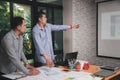 UX or UI designers designing on their smartphone application layout prototype project