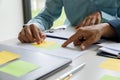 UX or UI designers designing on their smartphone application layout prototype project