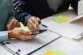 UX or UI designers designing on their smartphone application layout prototype project