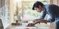 UX web developer working on his project about UX template while using laptop computer Royalty Free Stock Photo