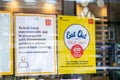 UXBRIDGE, LONDON/ENGLAND- 29 August 2020: Eat out to help out poster and other coronavirus related posters in window of McDonald`s