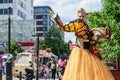 UXBRIDGE, LONDON, ENGLAND - 14 August 2021: Stilt performer wearing a butterfly costume at Uxbridge`s Love Summer Festival