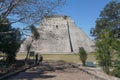 Uxmal, Mexico: Tourists visit the Mayan Pyramid of the Magician Royalty Free Stock Photo