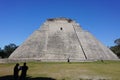 Uxmal, Mexico: Tourists visit the Mayan Pyramid of the Magician Royalty Free Stock Photo