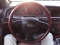 Uxury car interior details. Dashboard and steering wheel