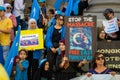 Uyghur Australian Protestor holding placard outside