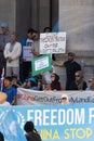 A Uyghur men holding a placard in a pro-uyghur demonstration outside of the SA Parliament House