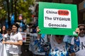 A Uyghur women holding a placard in a pro-uyghur demonstration in Adelaide, Australia Royalty Free Stock Photo