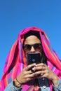 UYUNI, BOLIVIA - May 01, 2019: Woman using a cellphone Royalty Free Stock Photo