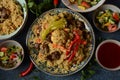 Uzbek cuisine food pilaf plov, salad achichuk achuchuk.