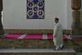 Uzbek man in the courtyard of a mosque in Shahrisabz, Uzbekistan