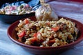 Uzbek national plov dish on a clay plate closeup