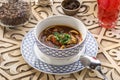 Uzbek noodle soup Lagman with noodles and lamb on oriental wooden table Royalty Free Stock Photo