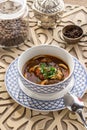 Uzbek noodle soup Lagman with noodles and lamb on oriental wooden table Royalty Free Stock Photo