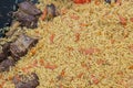 Uzbek pilaf in the market. Picnic with uzbek pilaf. Oriental pilaf. Close-up for menu design