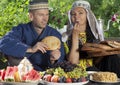 Uzbekistan couple have breakfast with flat cake