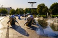 Uzbekistan, Tashkent - September 27, 2023: A fountain with shiny steel dolphins in Tashkent City Park.